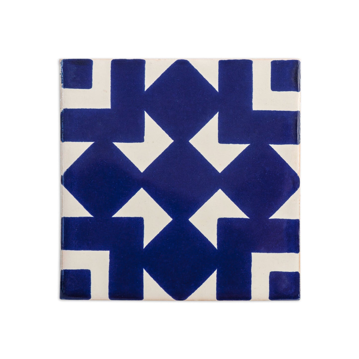 Dark blue and off-white Talavera tile by Clay Imports Handmade Tile, with an interlocking geometric pattern and slight texture.
