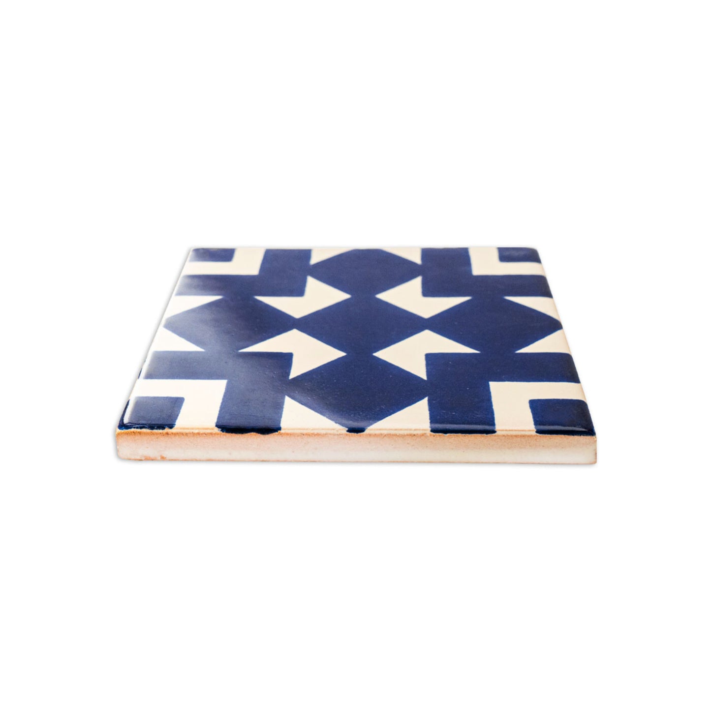 Blue and white Traditional Talavera tile with Santiago pattern from Clay Imports Handmade Tile, shown at an angle.