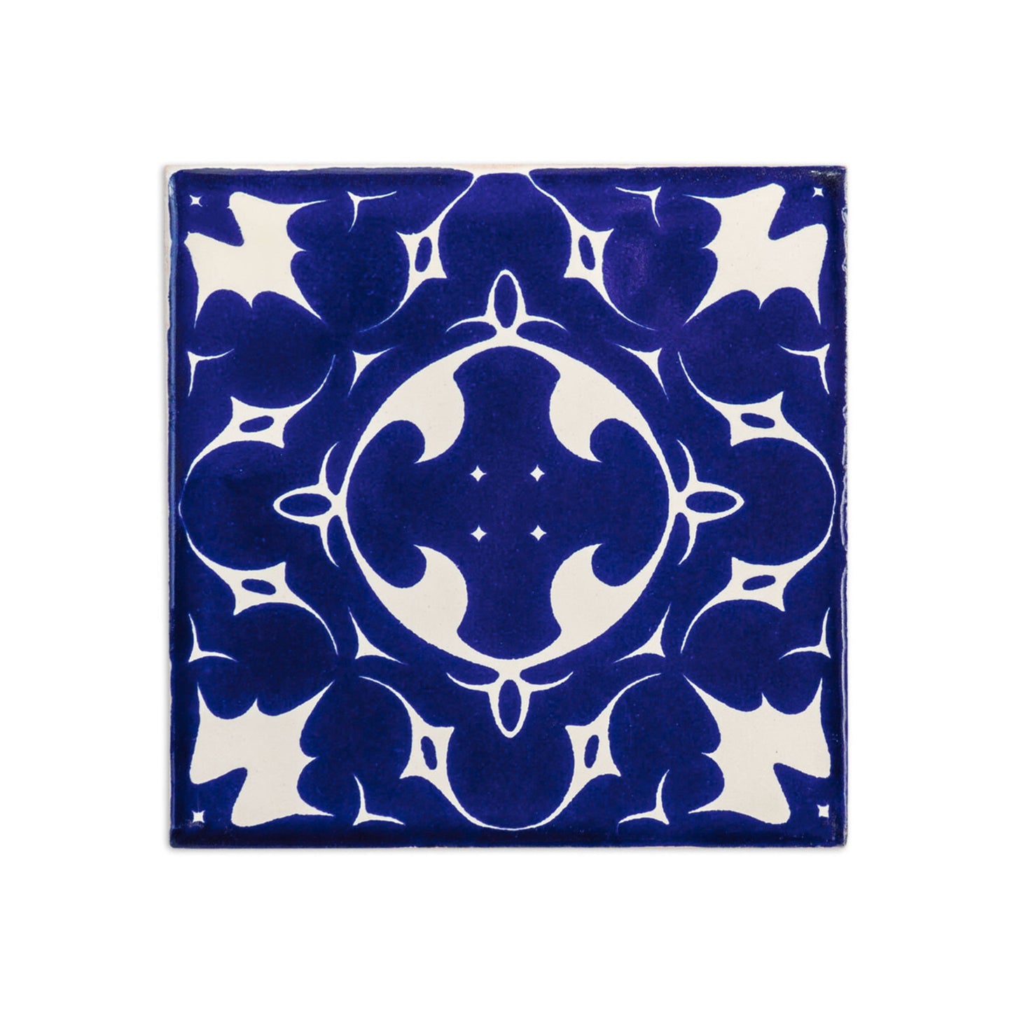Vibrant blue and cream Talavera tile by Clay Imports Handmade Tile featuring a detailed symmetrical pattern with star accents.