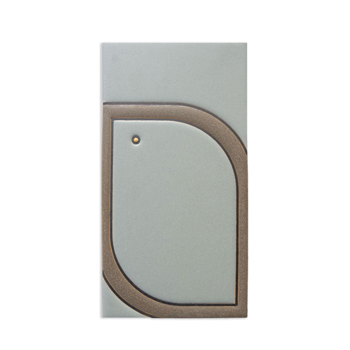 Muted green ceramic tile by Clay Imports, featuring a raised, textured brown border creating a left-sided leaf pattern with a small dot.