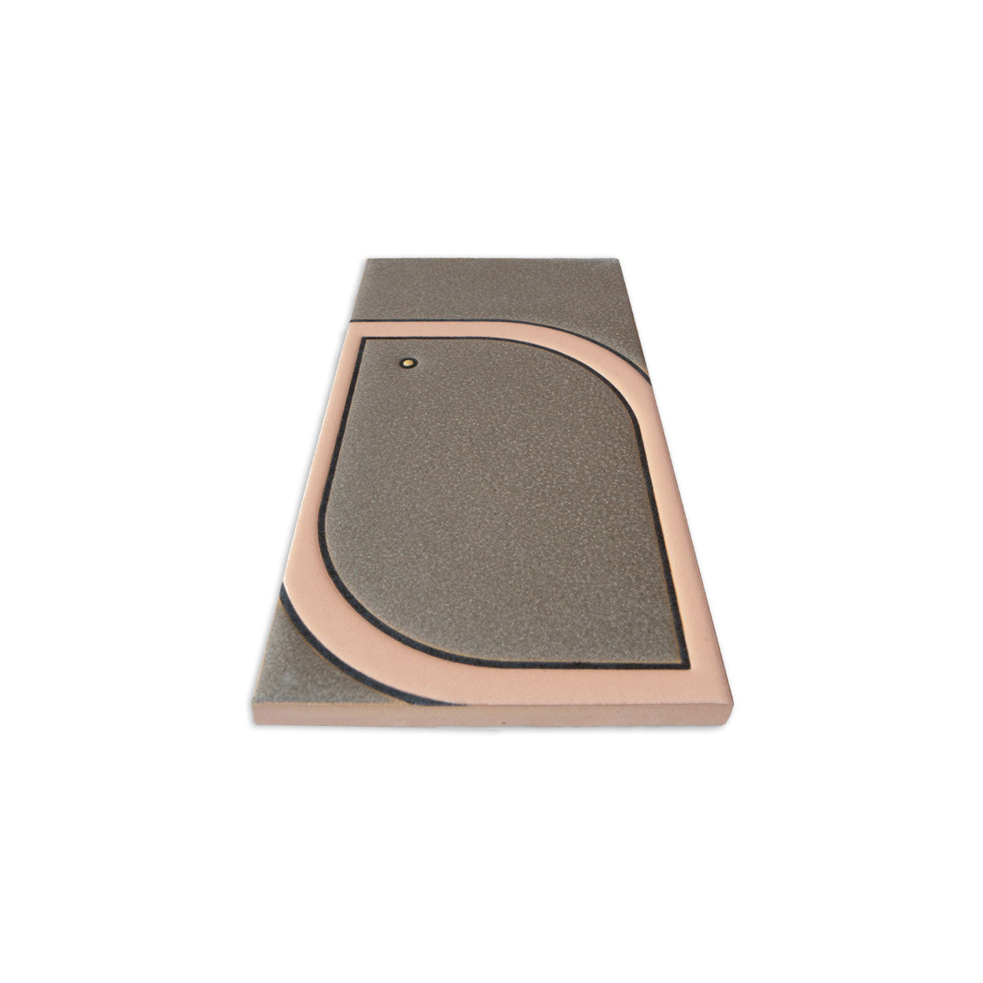Greenish-grey rectangular tile by Clay Imports, featuring a raised copper-colored geometric pattern with a small circle, viewed at an angle.