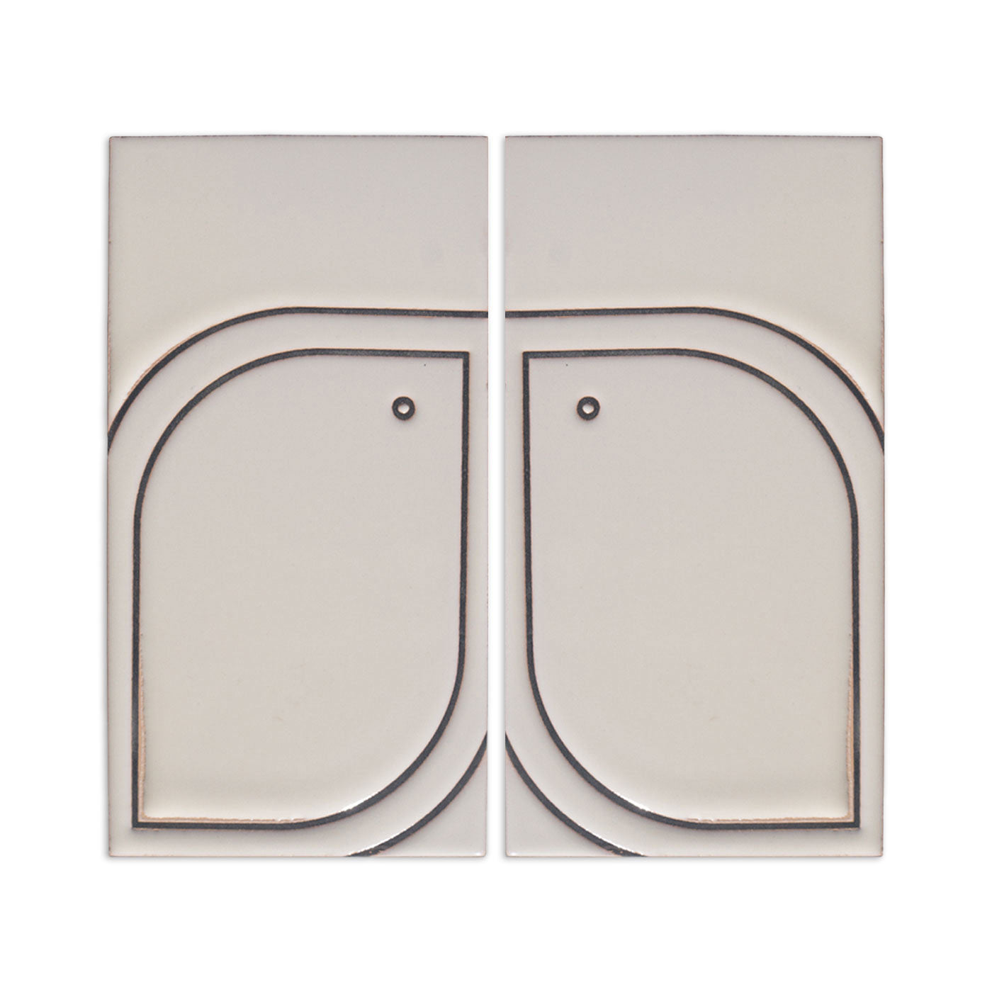Off-white sample tile by Clay Imports featuring an engraved minimalist bird design across two rectangular pieces.