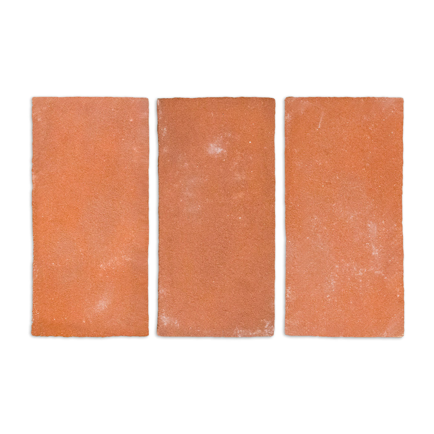 Three reddish-brown Cotto Tierra 4x8 sample tiles by Clay Imports, showcasing a natural, textured surface.