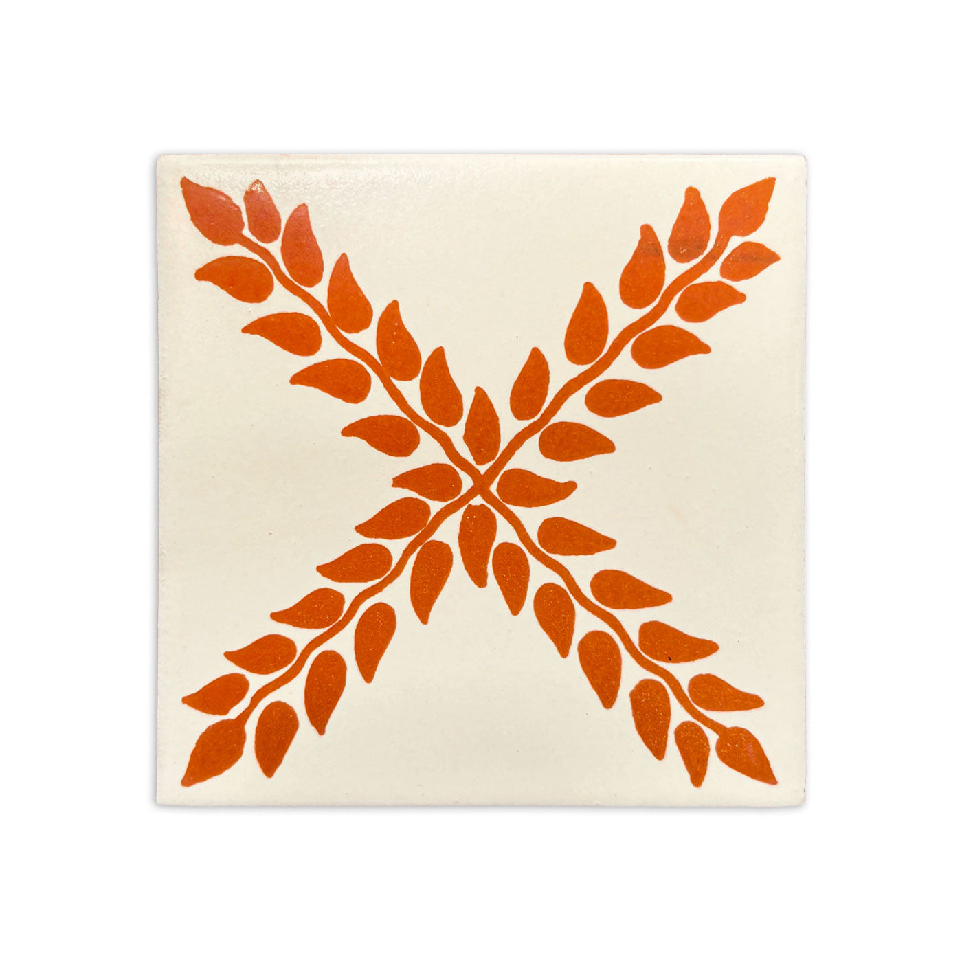 Talavera Arbor 4.25x4.25 tile by Clay Imports Handmade Tile, with an orange leafy 'X' pattern on a cream background.