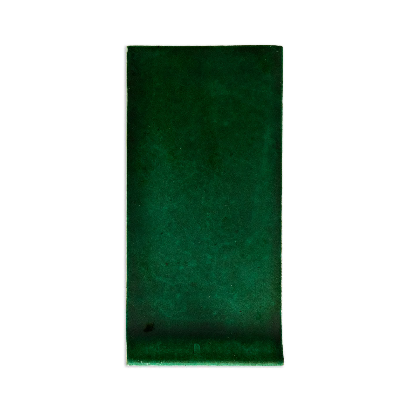 Forest green sample tile by Clay Imports with a mottled texture and slightly uneven edges.