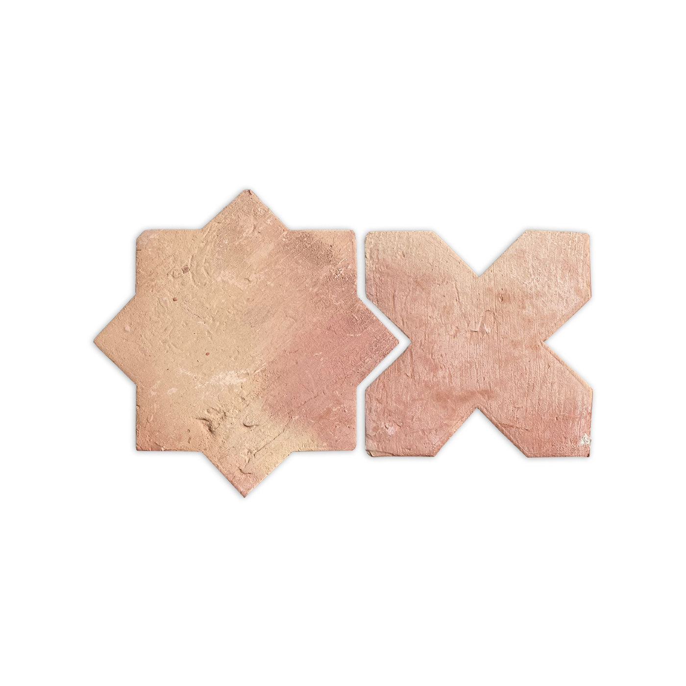 Antique matte terracotta Star & Cross tiles by Clay Imports, two pinkish-tan pieces with rustic texture on white.