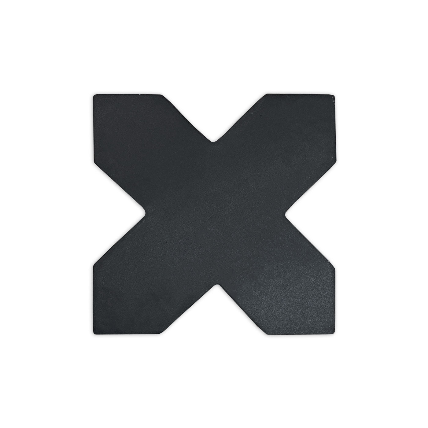 Black suede cross-shaped sample by Clay Imports, showing a matte, textured surface.
