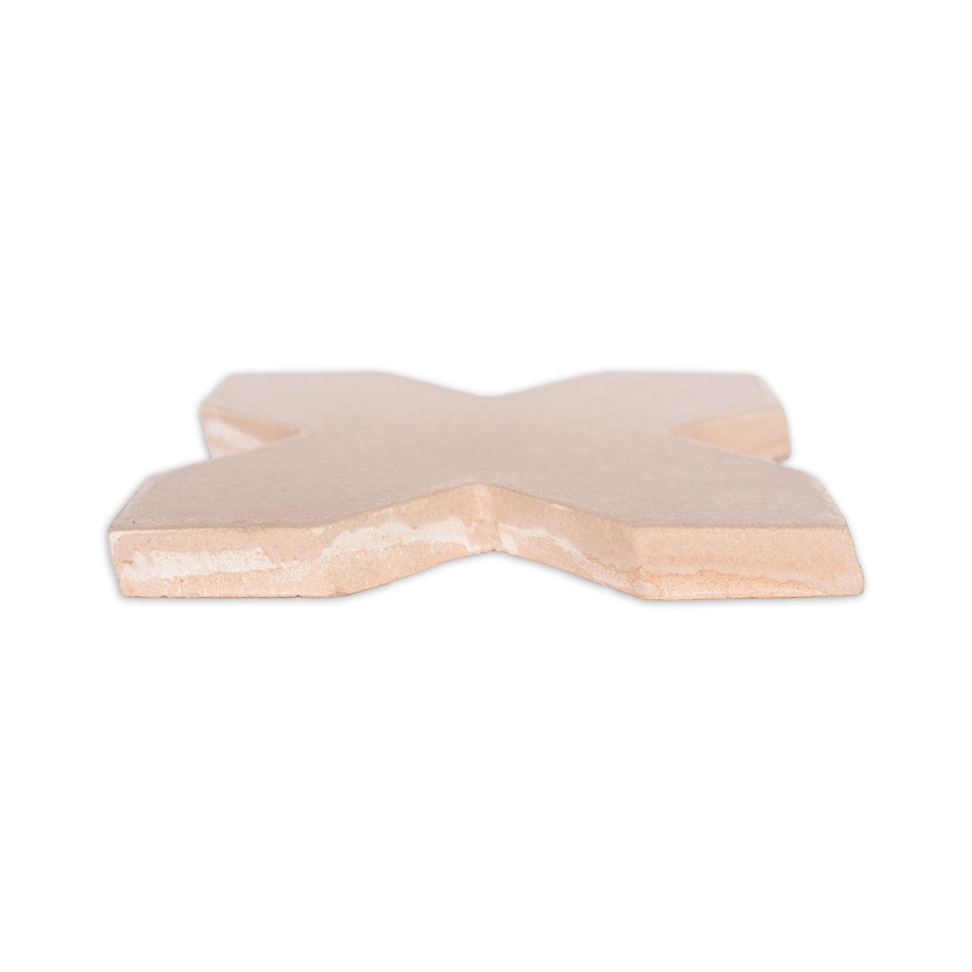 Light tan ceramic Star & Cross tile by Clay Imports, viewed from the side with rough, unglazed edges.