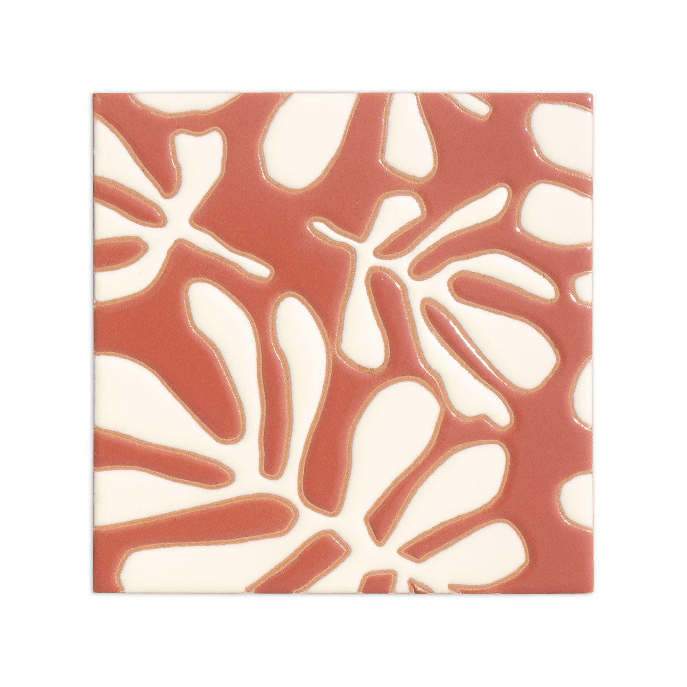 Square relief tile in yam and cream by Clay Imports with a glossy organic pattern.