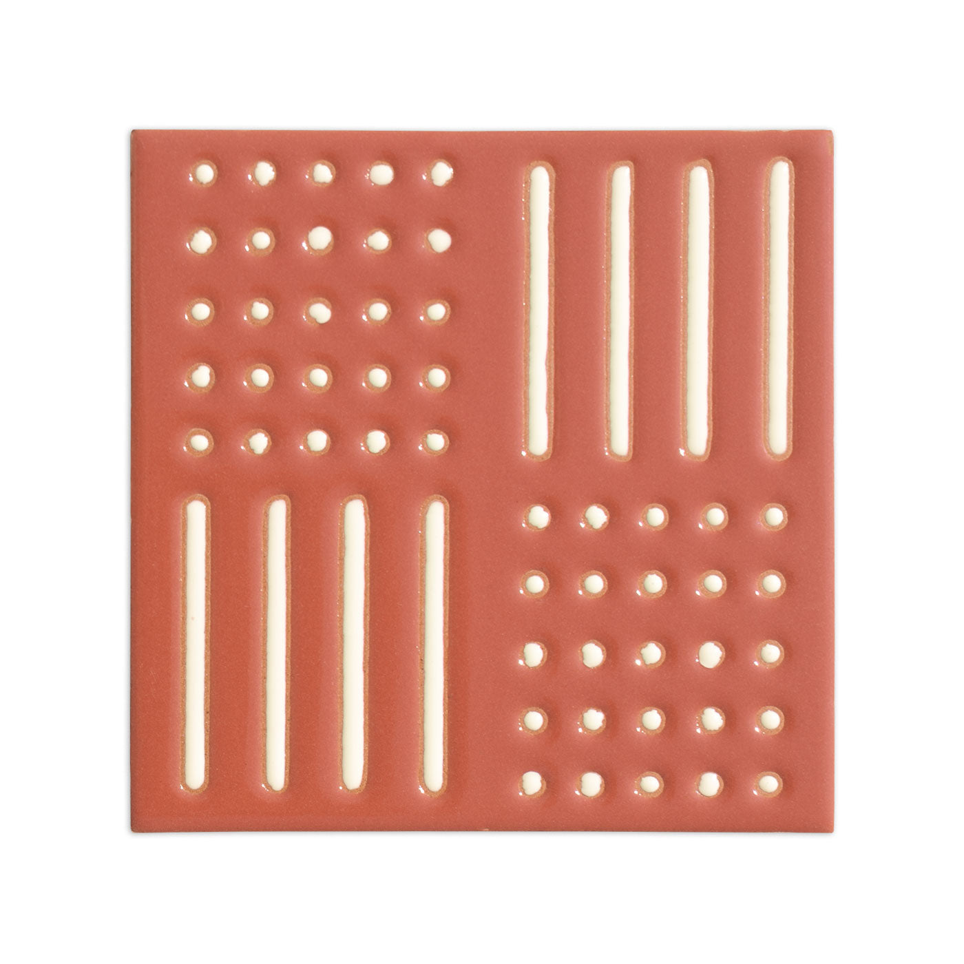 Reddish-brown relief sample tile by Clay Imports, with geometric patterns of vertical bars and circular dots.