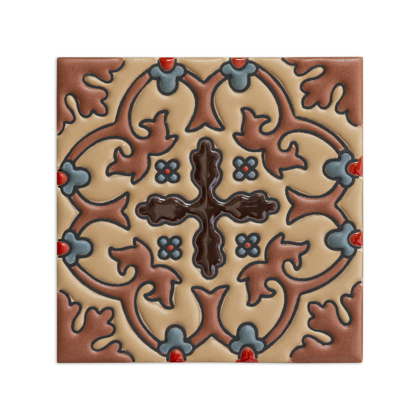 6x6 beige relief sample tile by Clay Imports with a dark brown cross, reddish-brown scrollwork, and blue-grey accents.