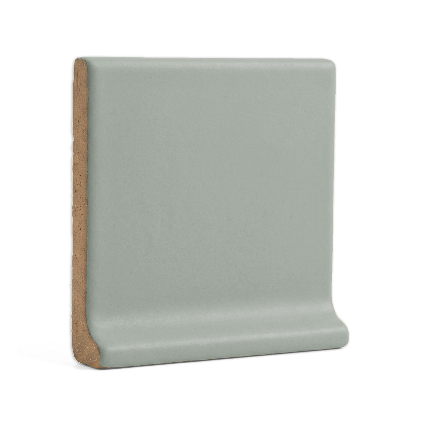 Agave solid cove base tile trim by Clay Imports, with a curved profile and speckled matte surface.