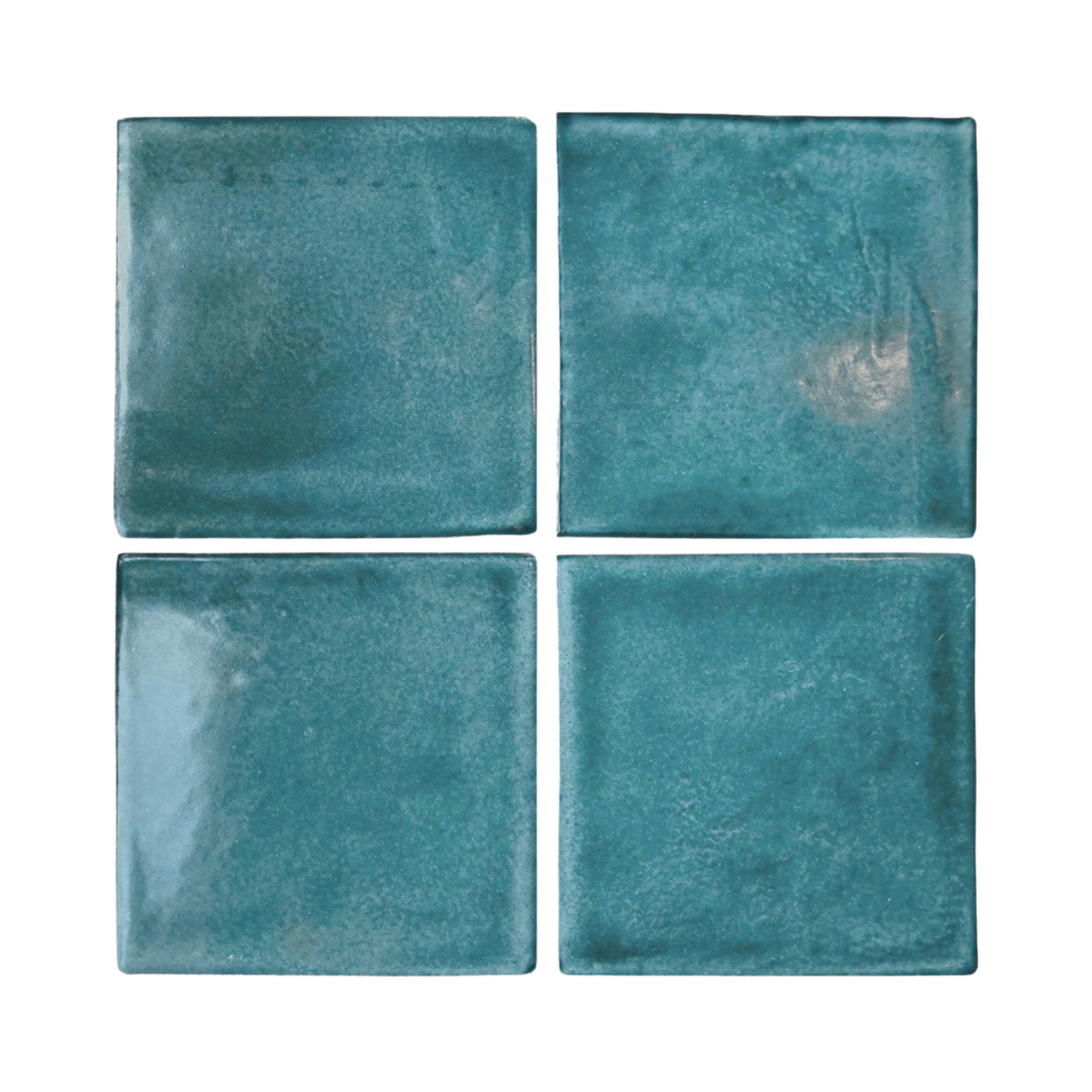 Sample of four square Glazed Cotto tiles in midnight teal by Clay Imports, with an irregular, mottled glaze texture.