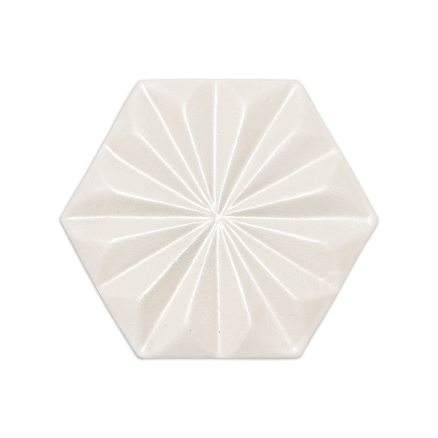 Off-white hexagonal tile sample by Clay Imports, with a glossy starburst pattern.