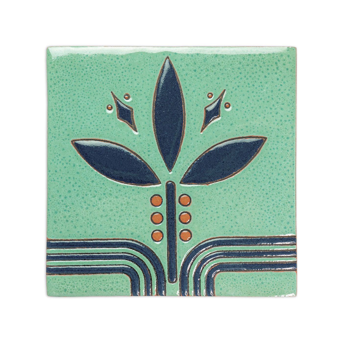 Jade green Relief Sample by Clay Imports with a stylized dark blue plant design and orange dots on a speckled background.