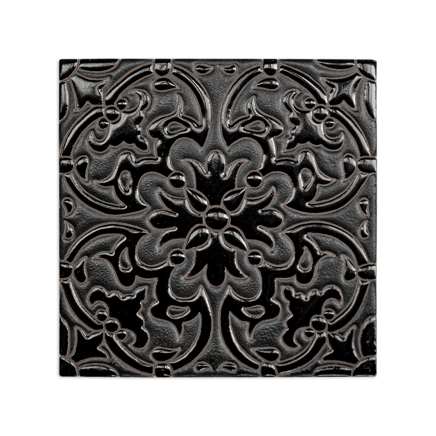 Black relief tile with intricate floral and scroll pattern, glossy finish, 6x6 inch square, front view
