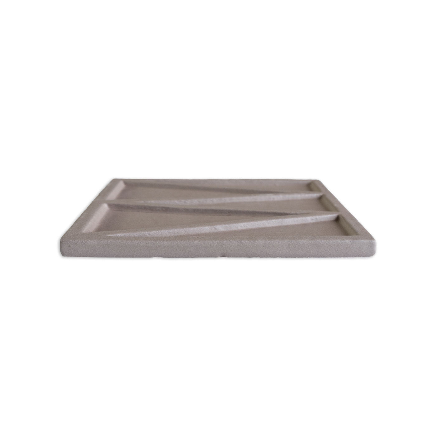 Brown solid tile by Clay Imports with geometric raised ridges forming three sections, low-angle side view.