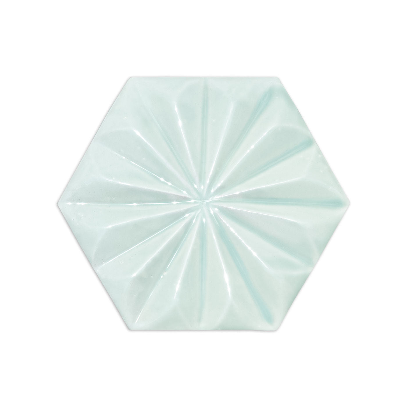 Spearmint 3 hexagonal tile by Clay Imports, with a glossy finish and faceted fan pattern.