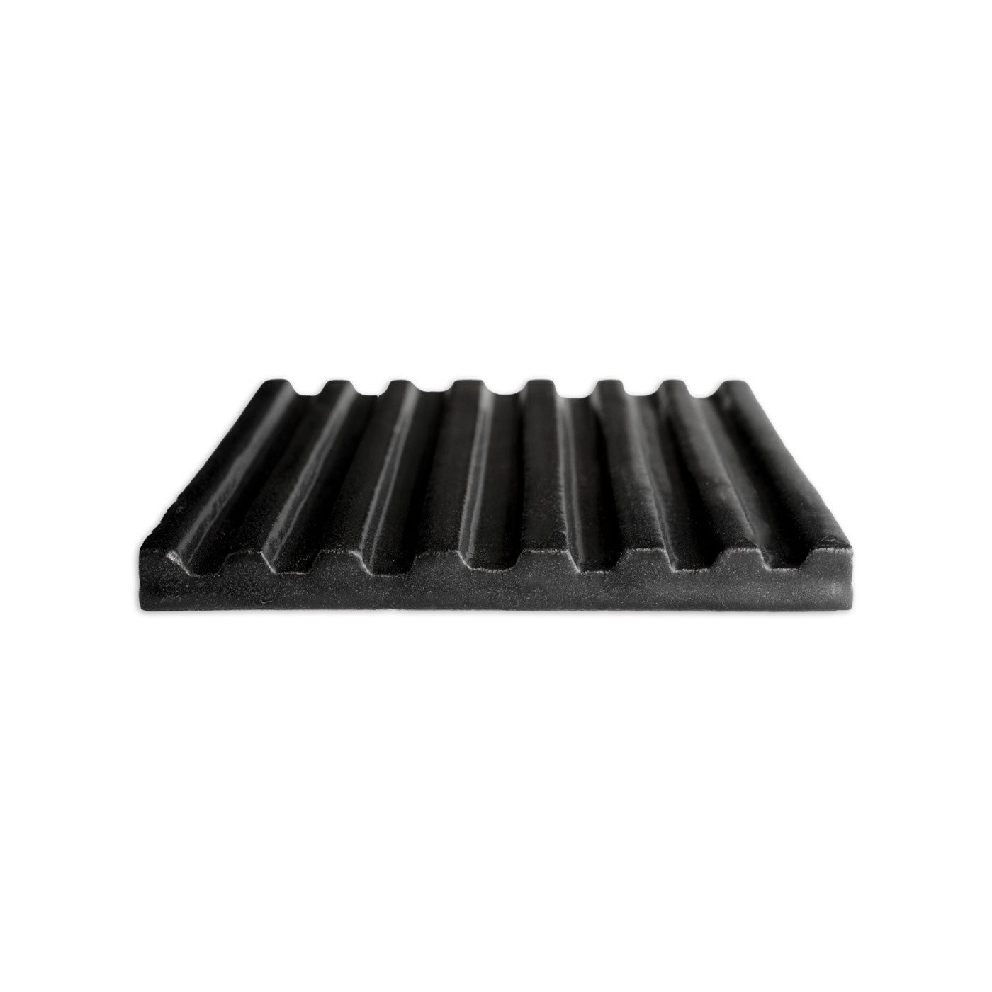 Black ridged tile with a suede-like texture by Clay Imports, shown from an angled side view.