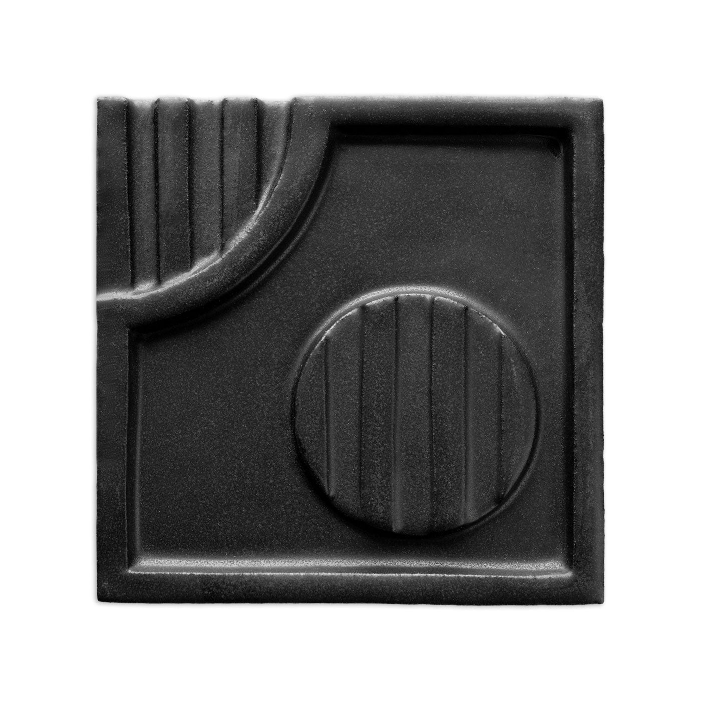 Black suede-finish square tile by Clay Imports featuring an abstract geometric pattern with vertical grooves.