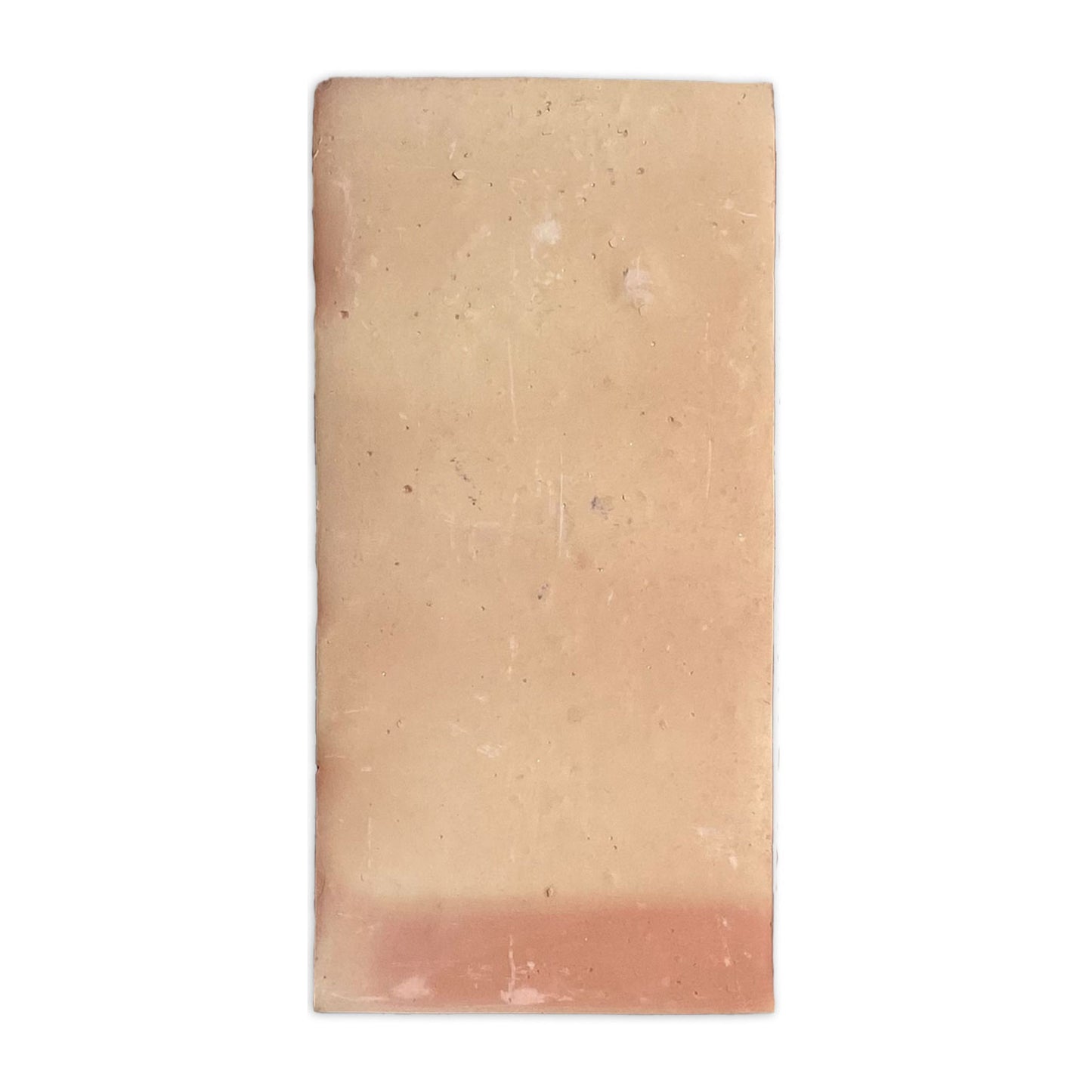 Smooth matte 6x12 sample tile by Clay Imports, pale terracotta with a reddish-brown lower section.