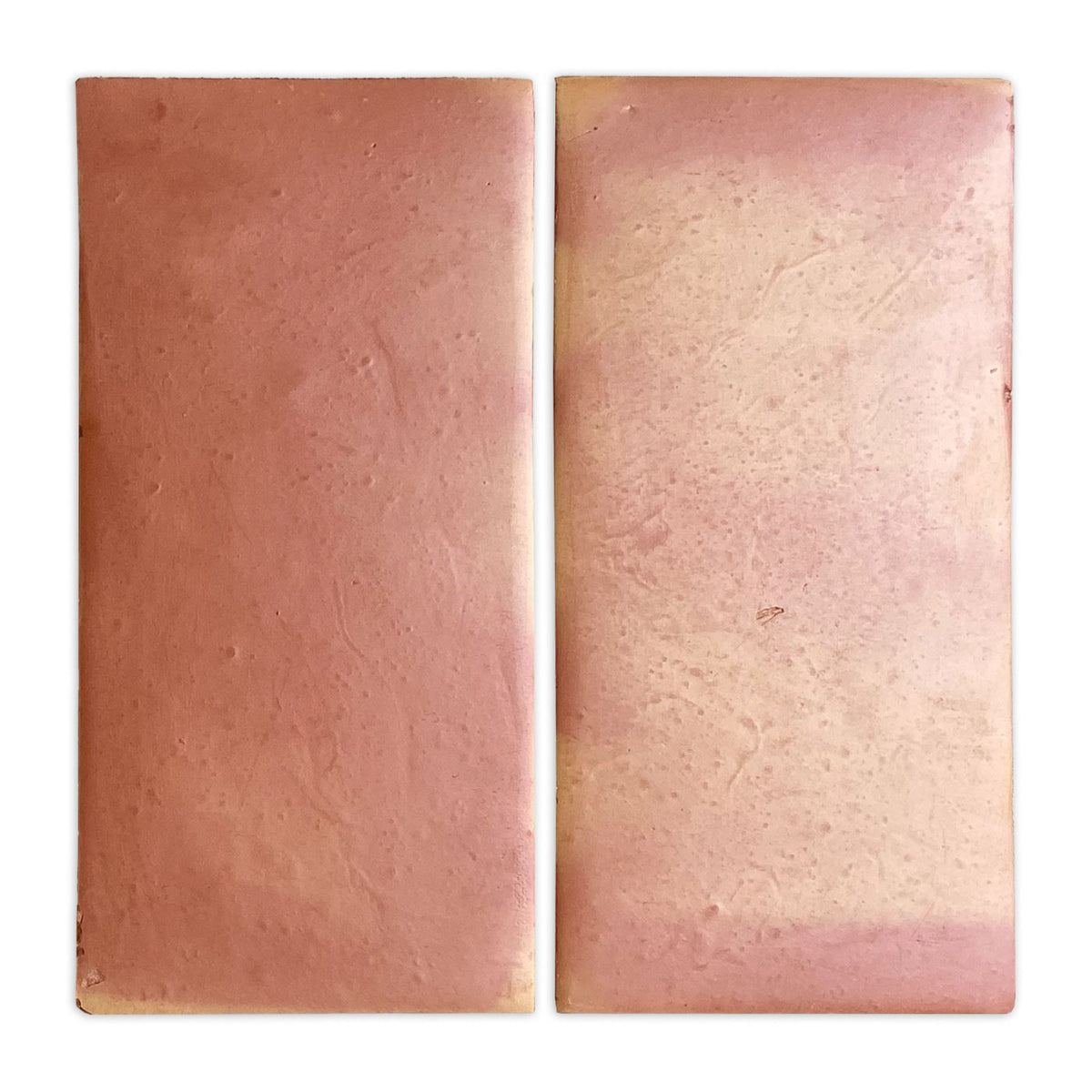 Smooth satin reddish-brown terracotta tile by Clay Imports, two rectangular pieces, one uniform, the other faded.