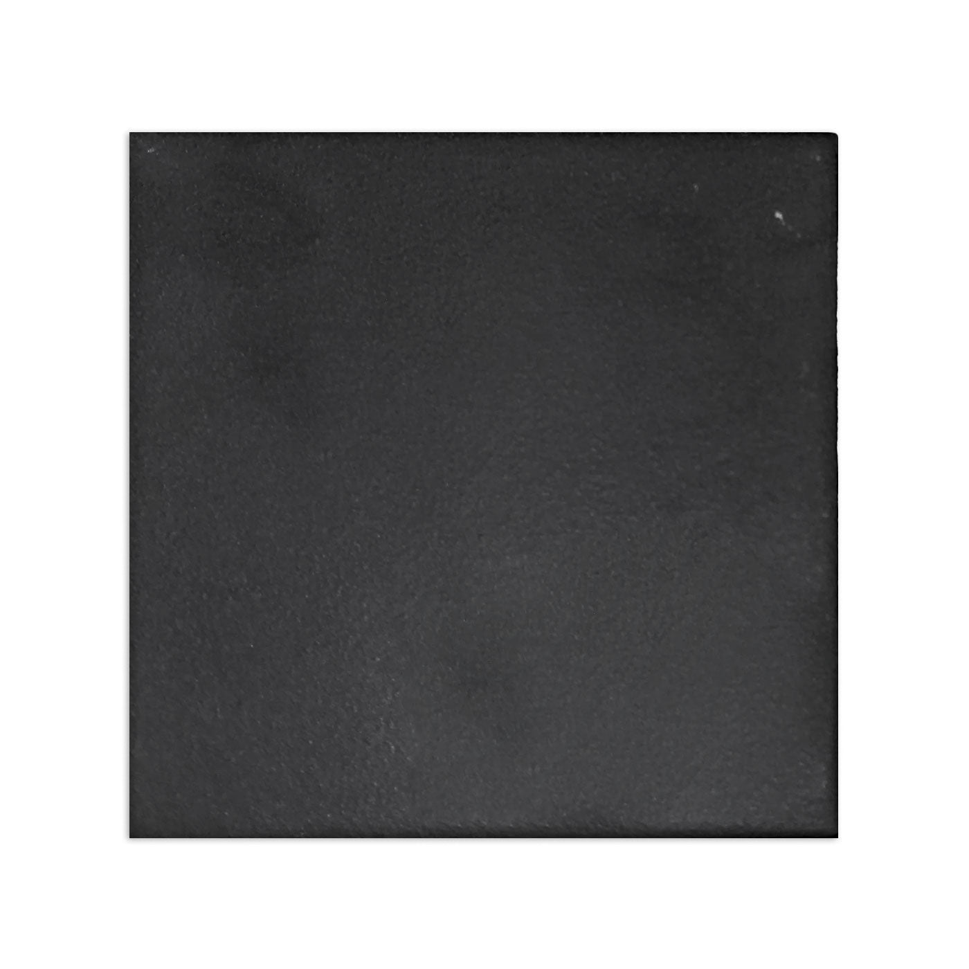 Black suede square clay tile by Clay Imports, showing a textured surface and slightly irregular edges.