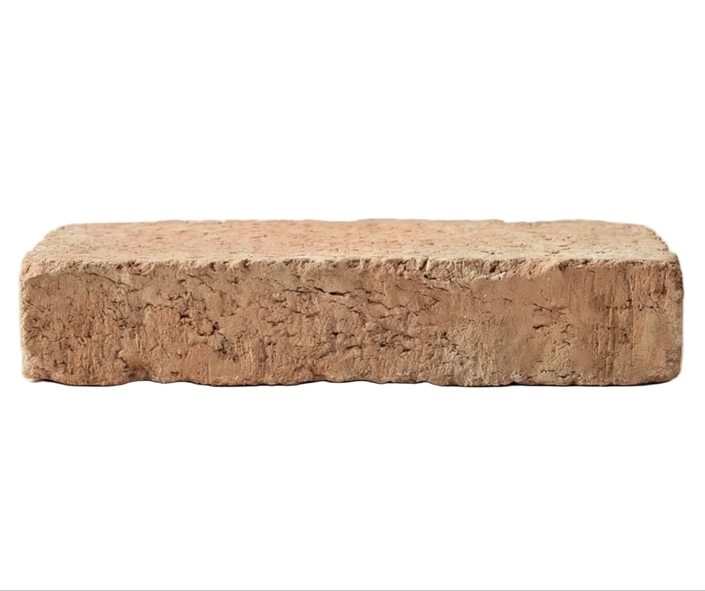 Terracotta rustic brick paver by Clay Imports Pavers with a rough, textured surface, shown from a side view.
