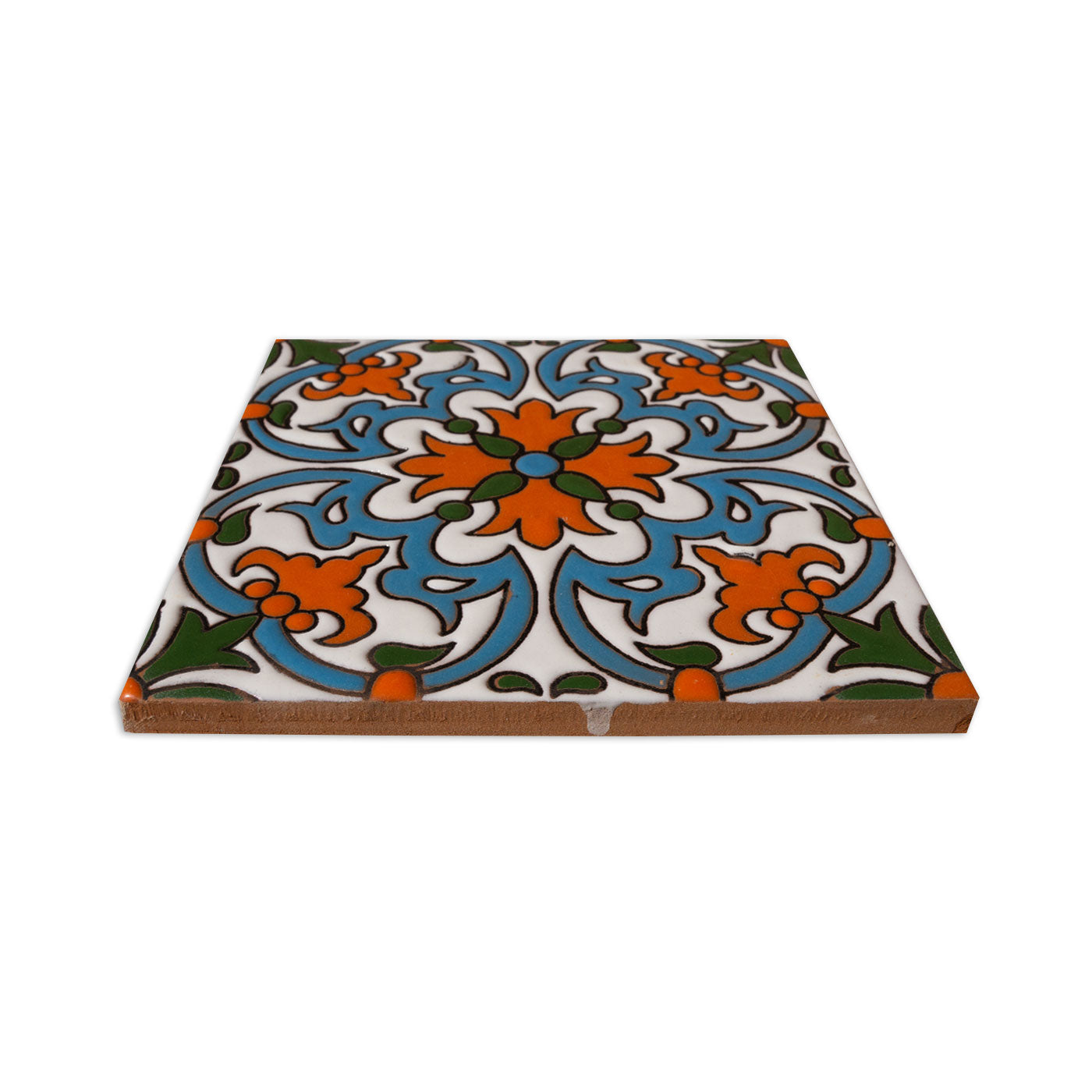 A 6x6 Relief Talavera tile from Clay Imports, featuring a white background with orange, blue, and green floral and curvilinear raised patterns, angled view.