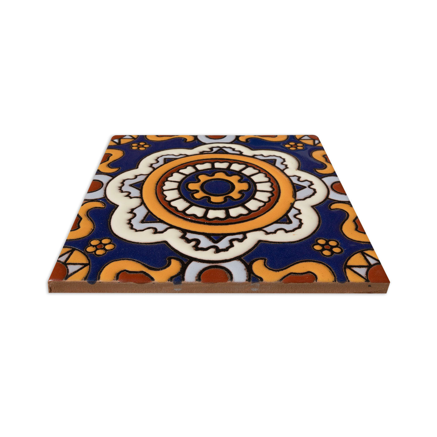Decorative sample tile by Clay Imports with a vivid blue, orange, and white relief floral pattern, angled.