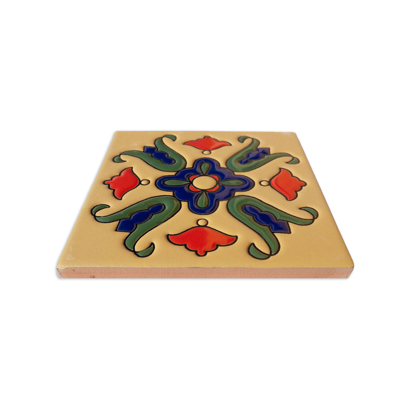 Yellow Lirio relief tile sample by Clay Imports, with embossed red, blue, and green floral patterns, shown at an angle.