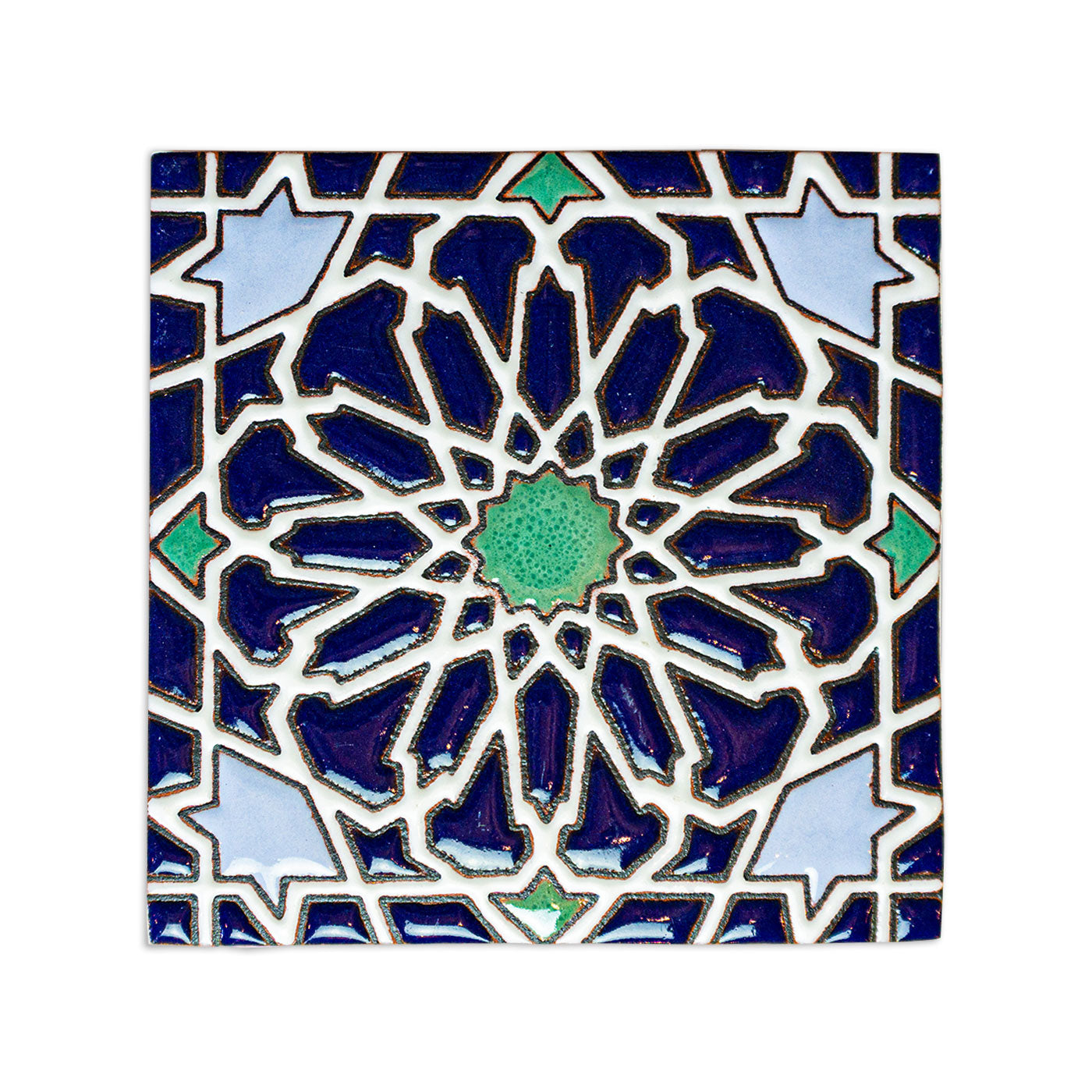 Deep blue Layla pool waterline tile sample by Clay Imports, with a complex geometric pattern in blue and green.
