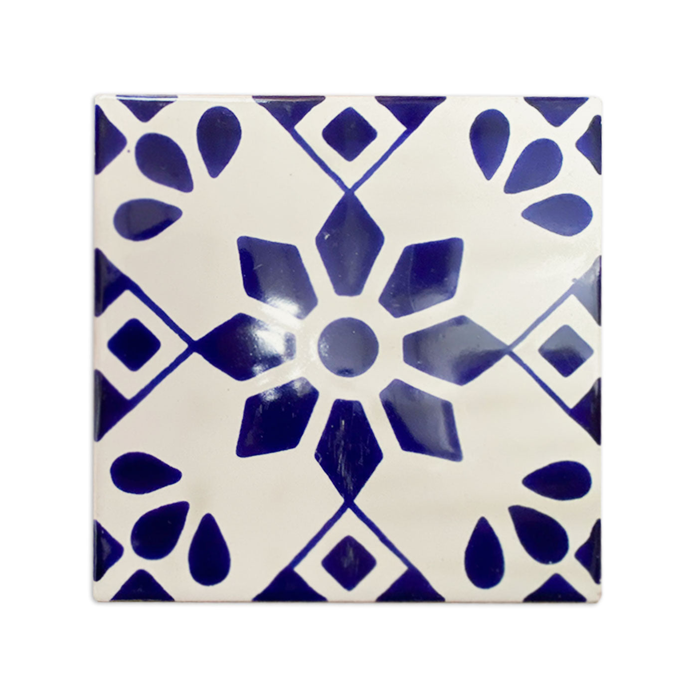 Square white and blue Talavera tile sample from Clay Imports Handmade Tile featuring a central floral and geometric pattern.