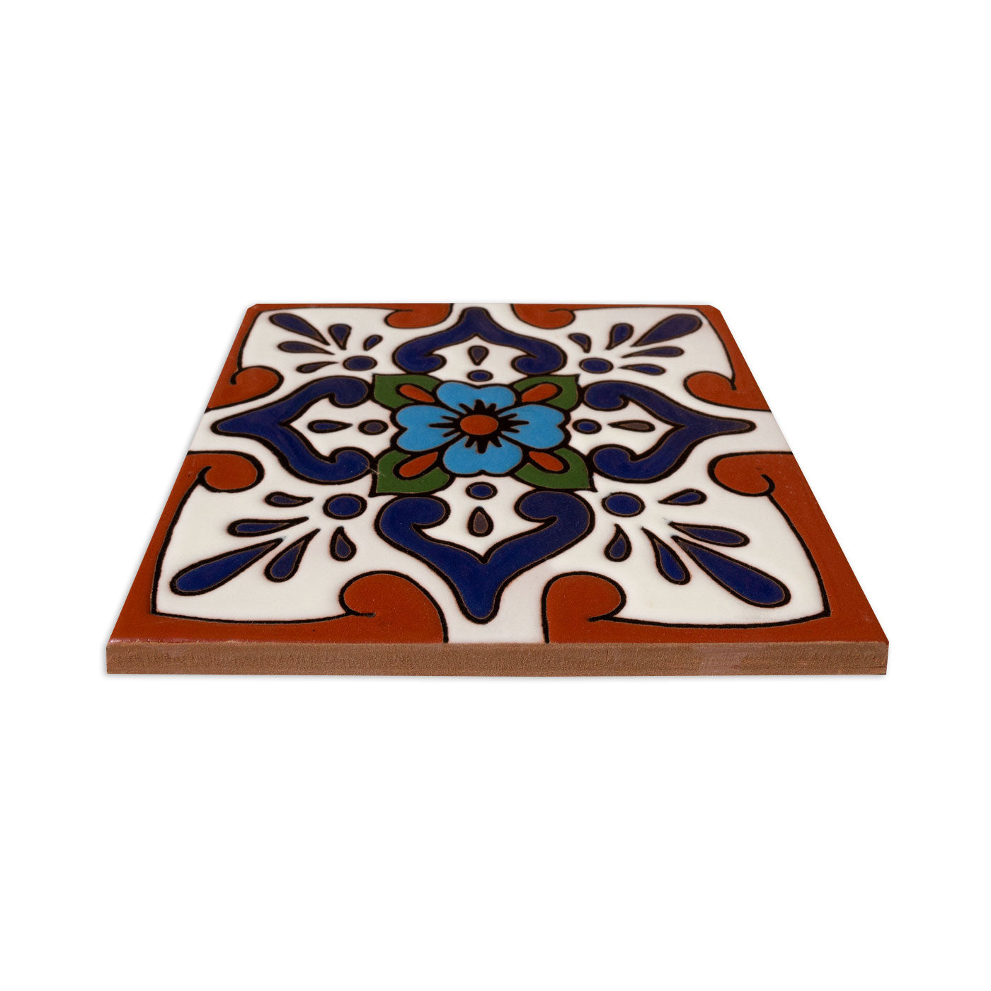 Relief Talavera tile by Clay Imports with a central blue flower, dark blue swirls, and terracotta edges on a white background.