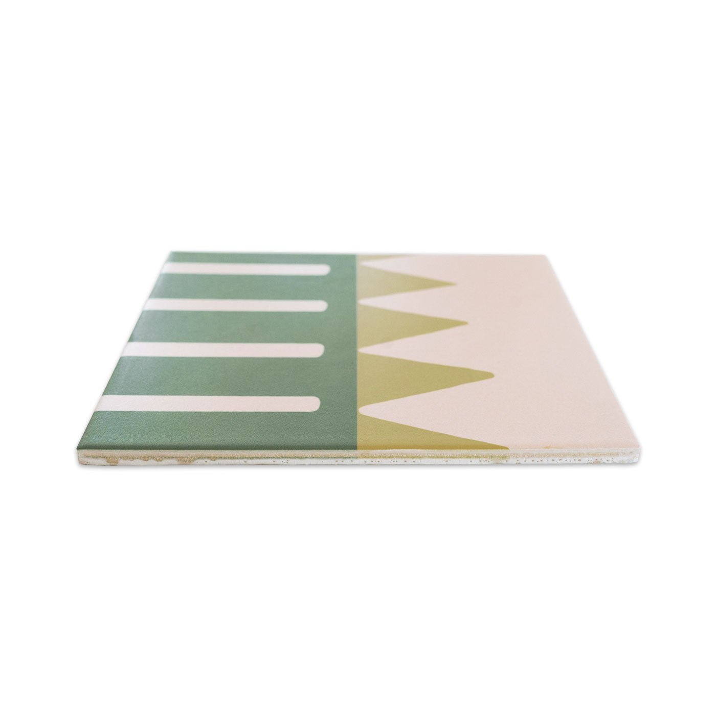 Square pattern tile by Clay Imports with a dark green striped section and light green triangle pattern, side view.