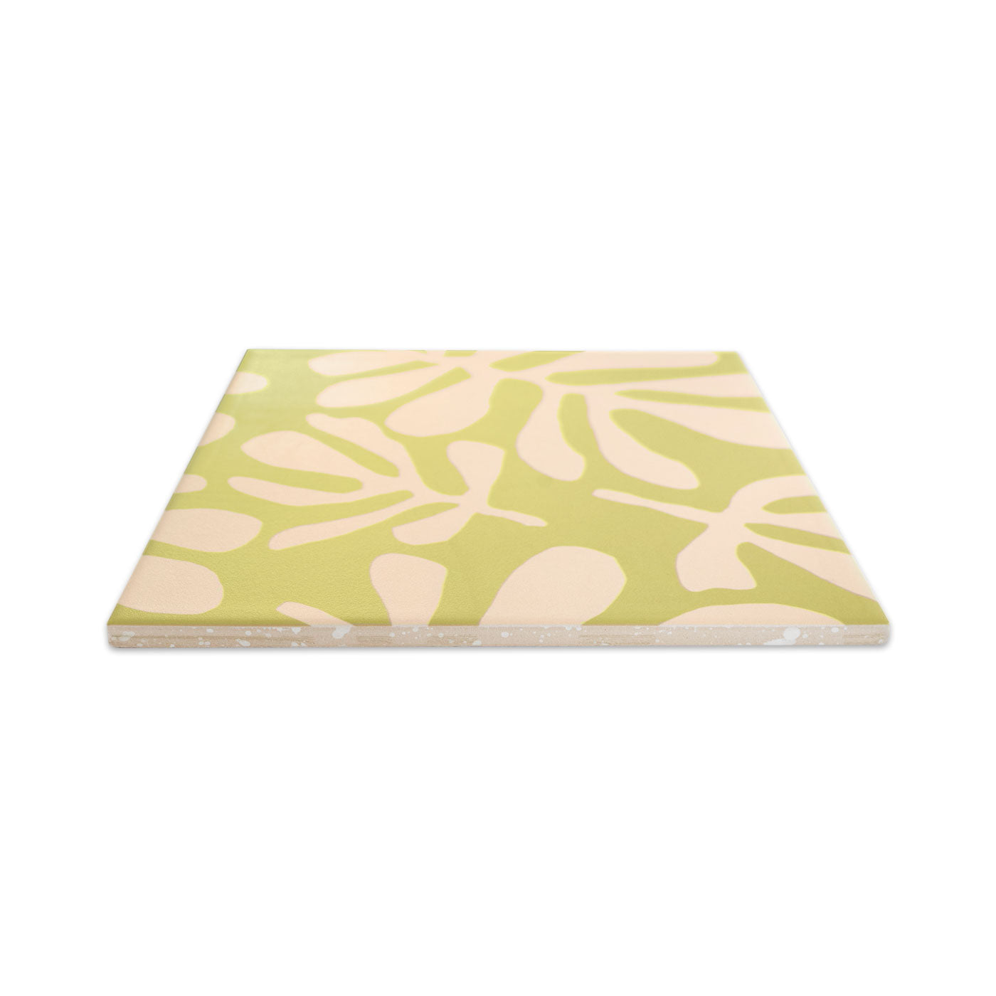 Avocado green pattern tile by Clay Imports with a beige Miti leaf design, angled to reveal its textured side.