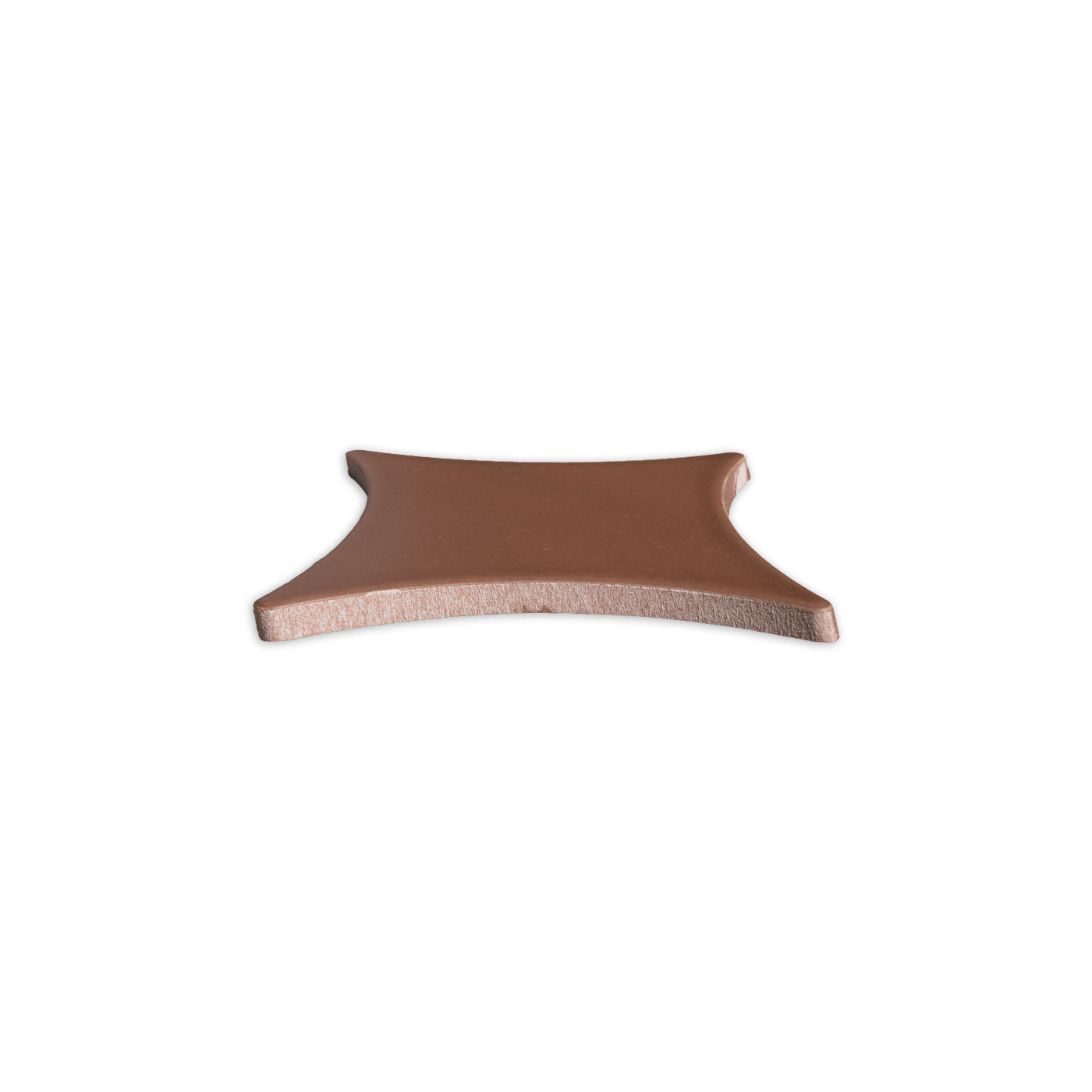 Reddish-brown concave square solid tile by Clay Imports, viewed from the side showing its smooth surface and thickness.