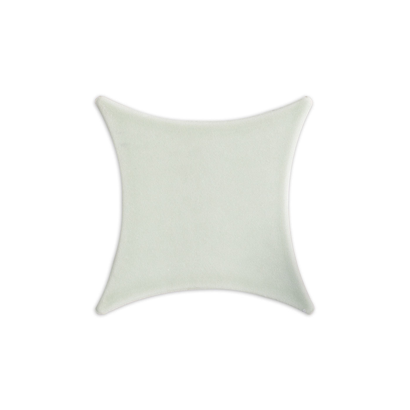 A light green Rombo solid tile by Clay Imports with four concave sides and pointed tips.