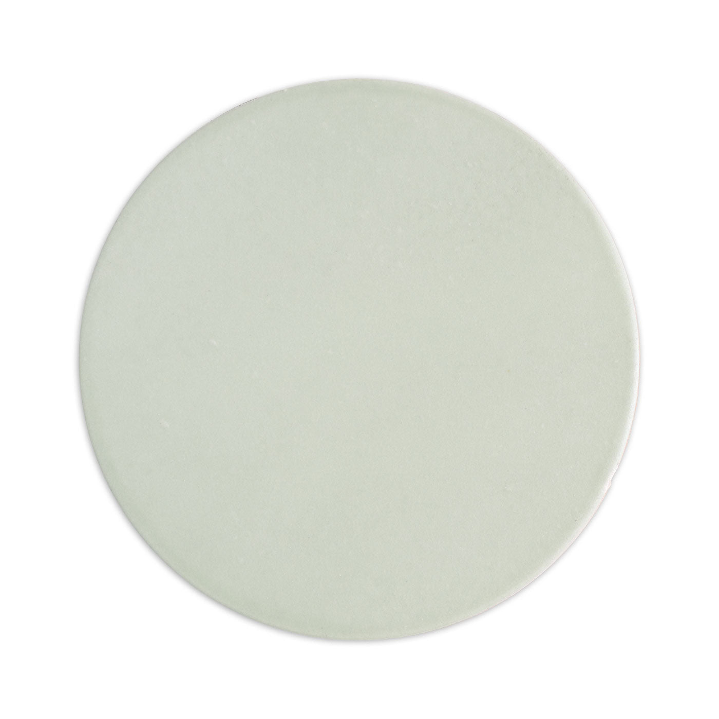A circular light green solid tile by Clay Imports with a matte finish.