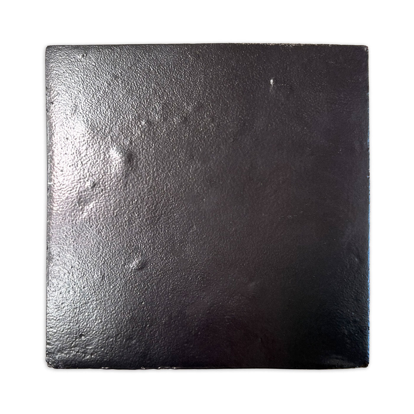 Glazed Smooth Noir Black 8x8 tile bundle by Clay Imports, displaying a bumpy, reflective surface.