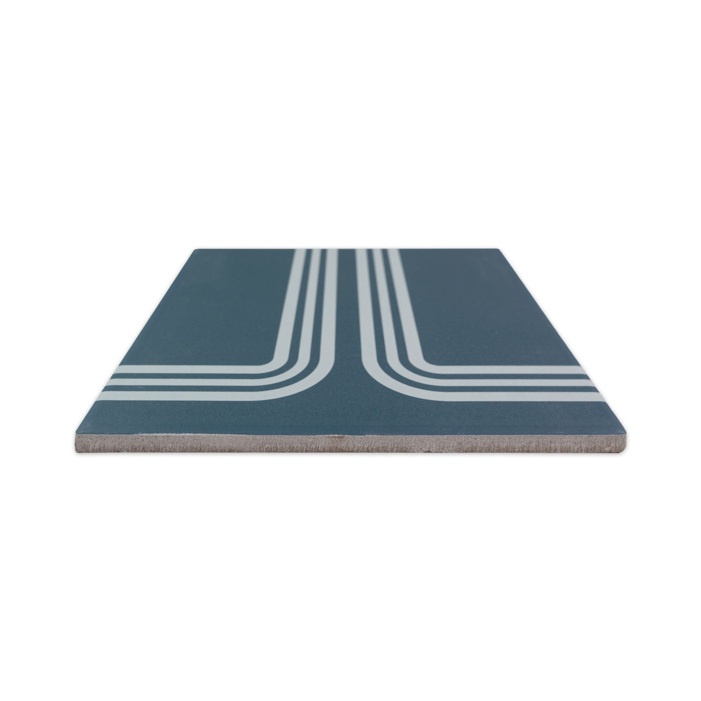 Midnight blue pattern tile by Clay Imports featuring white double parallel lines in a retro track design, viewed from the side.