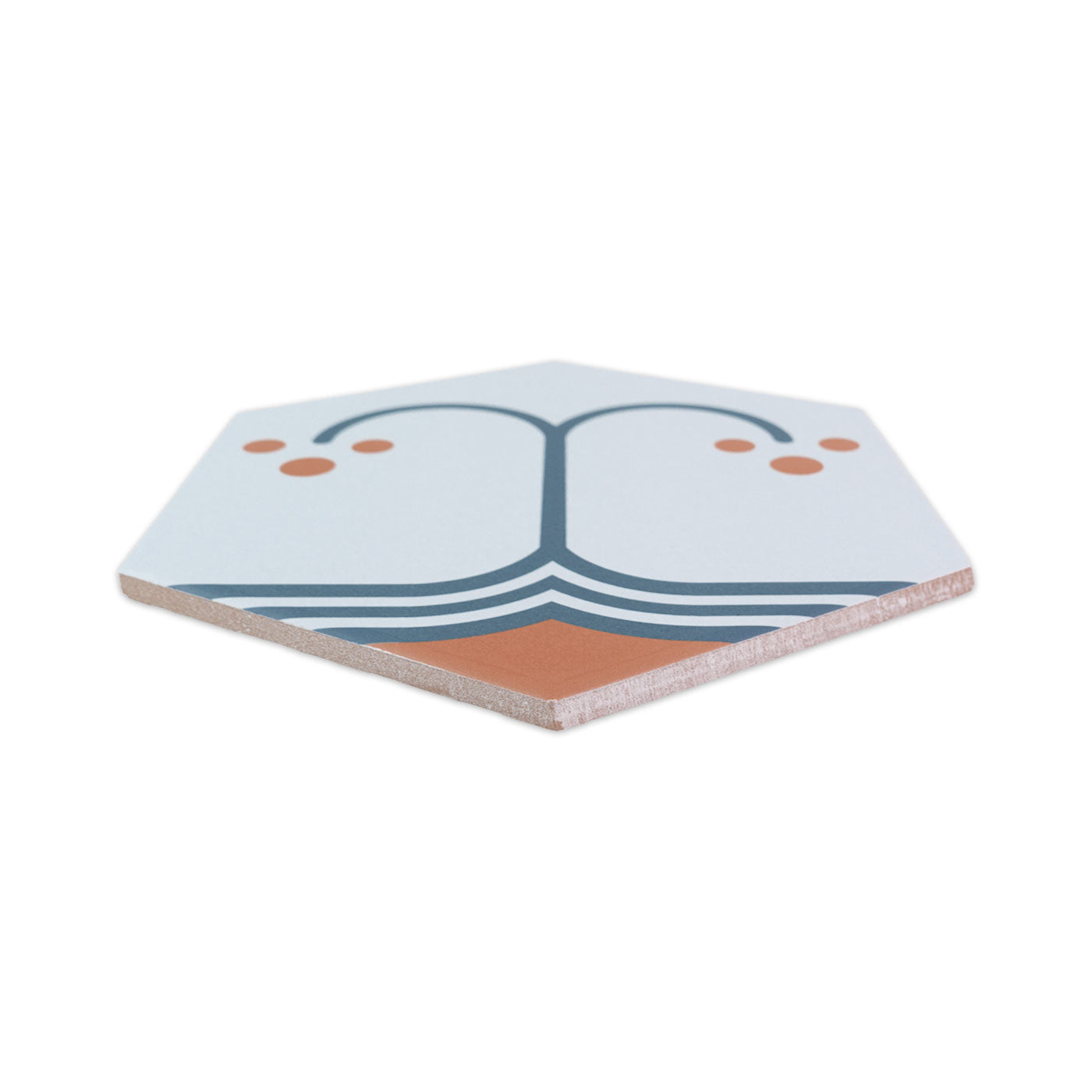 Hexagonal pattern tile by Clay Imports with an abstract blue-grey and orange design on a light background, viewed at an angle.
