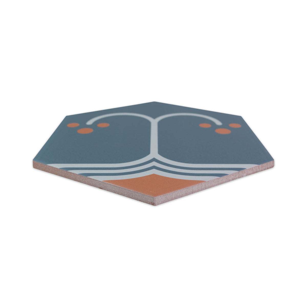 Hexagonal pattern tile in blue-grey, white, and orange by Clay Imports, featuring an art deco-inspired design, shown from a raised angle.