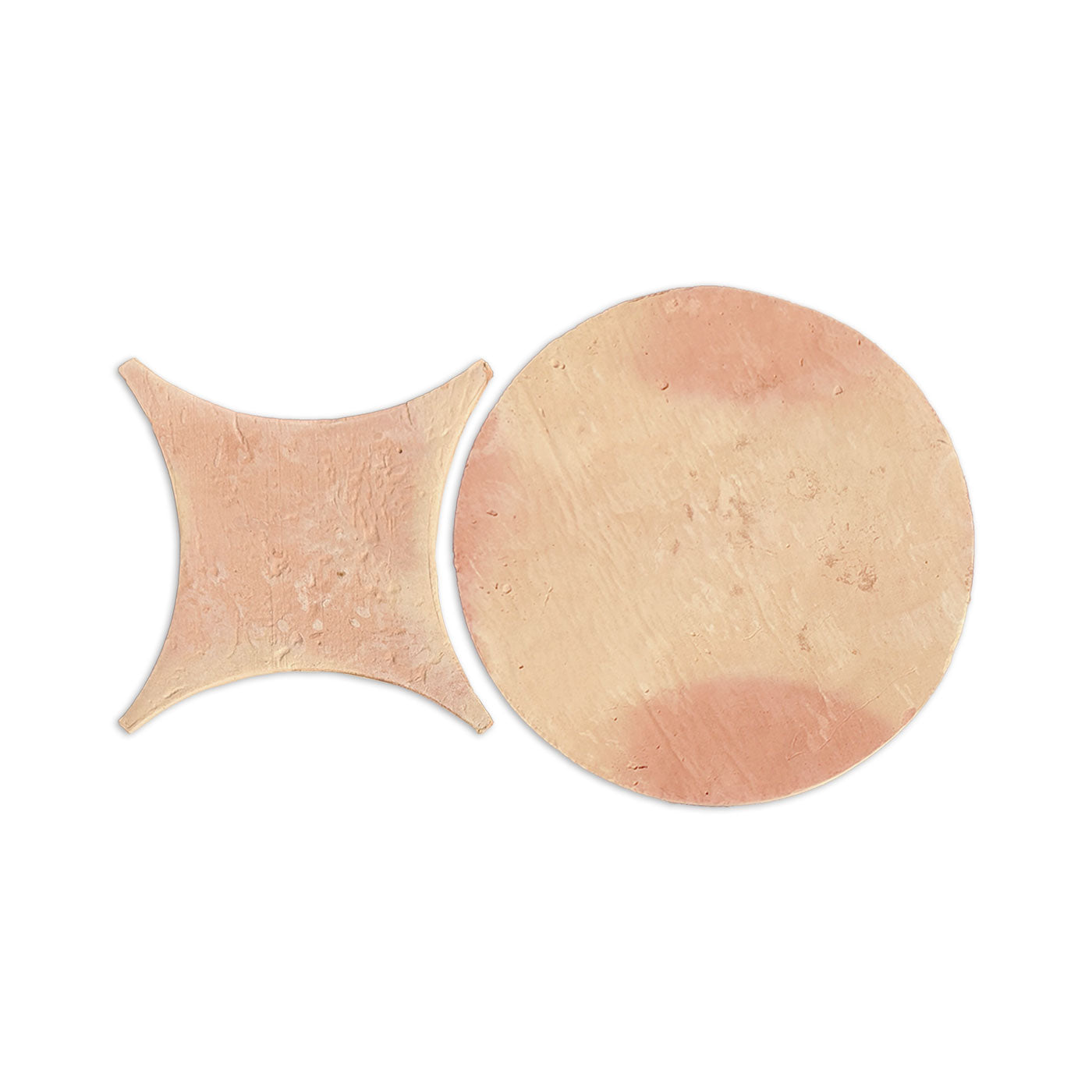 Terracotta Texas Penny Antique Matte tiles by Clay Imports, featuring one circular and one curved square piece.