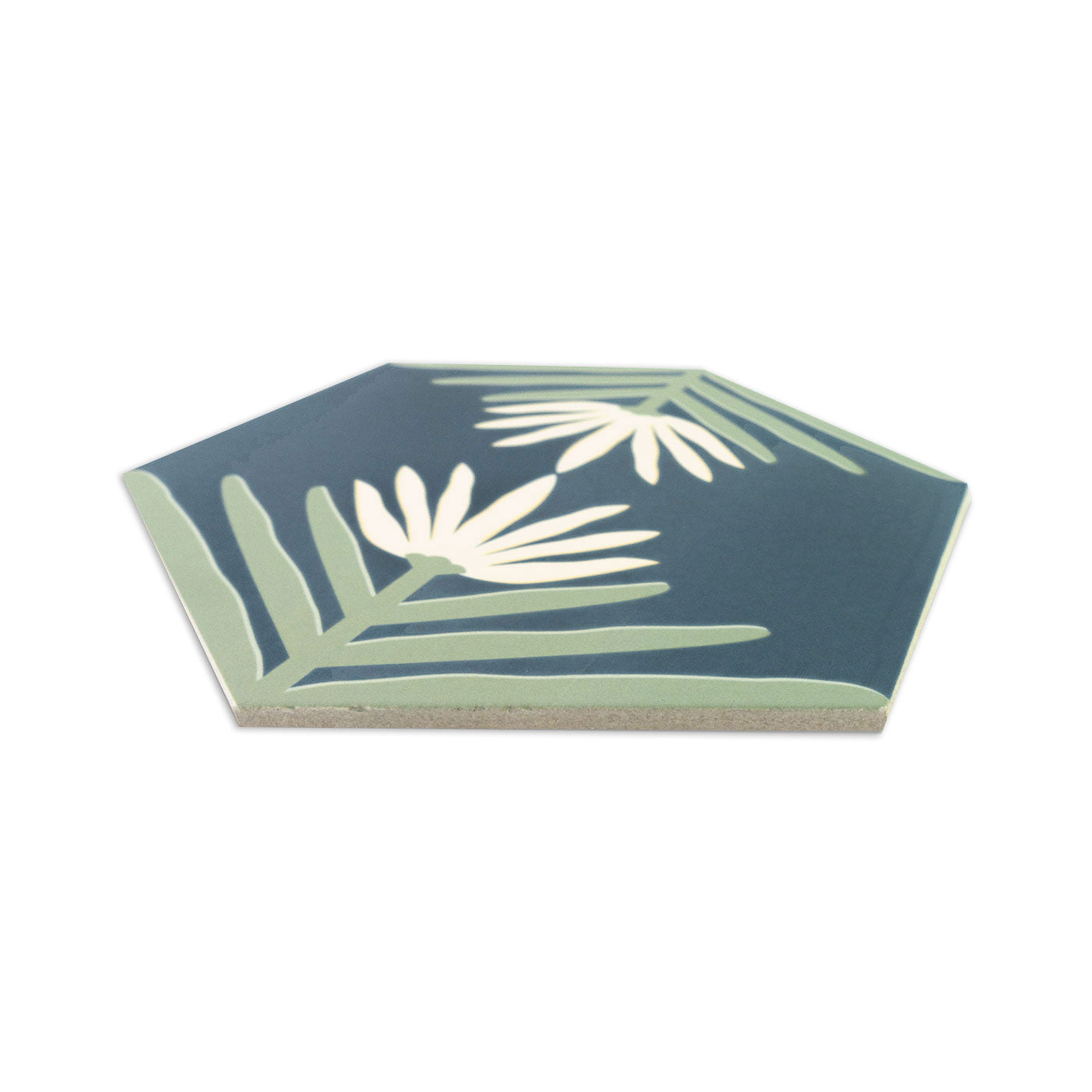 Hexagonal midnight blue pattern tile by Clay Imports, featuring light green and cream lotus leaves and flowers at an angle.