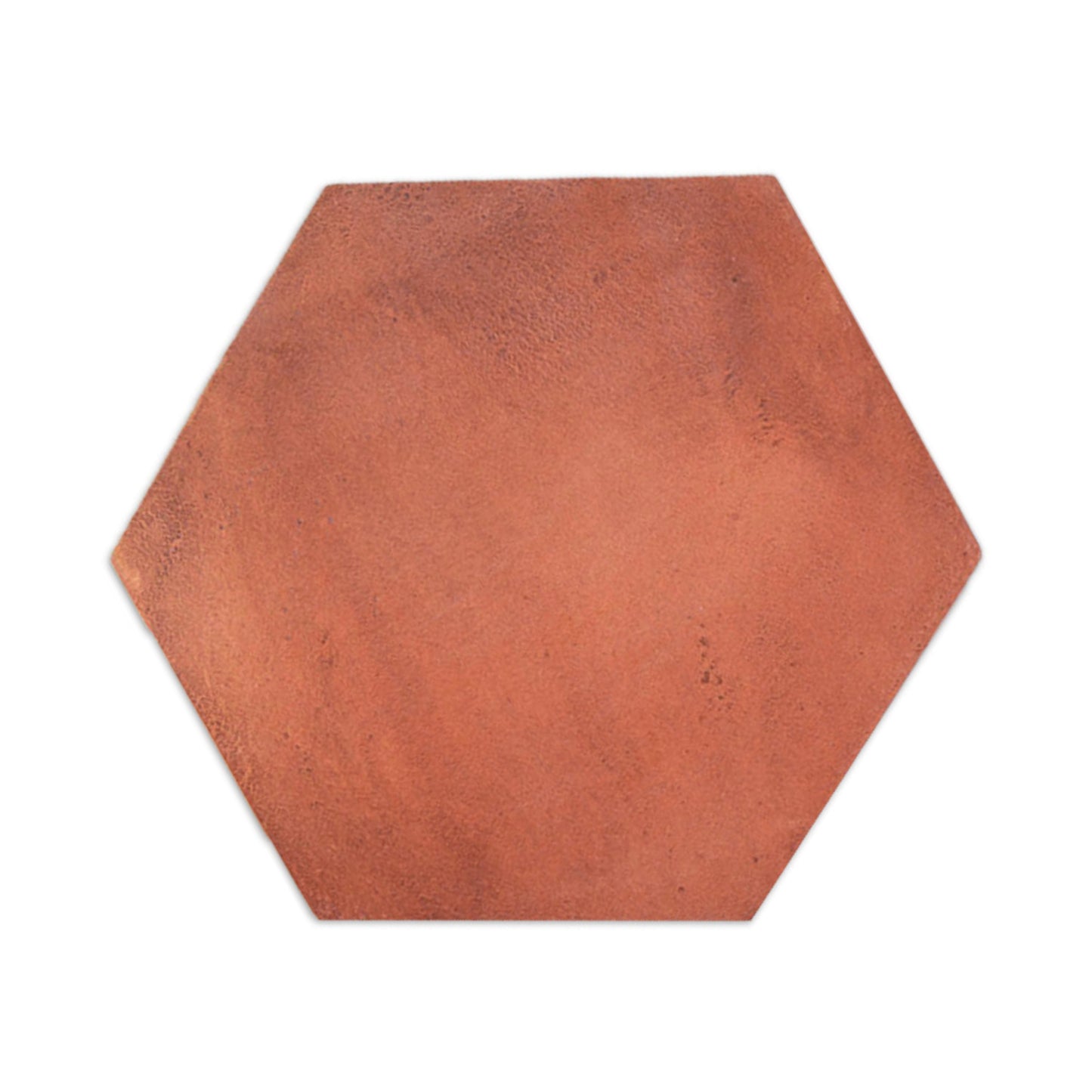 Cotto Tierra hexagon tile sample by Clay Imports with a rustic, textured reddish-brown surface, casting a subtle shadow.