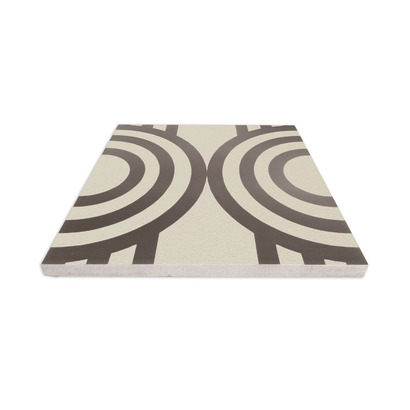 Champagne 8x8 tile sample from Clay Imports with dark brown concentric circle pattern on a light background, viewed at an angle.
