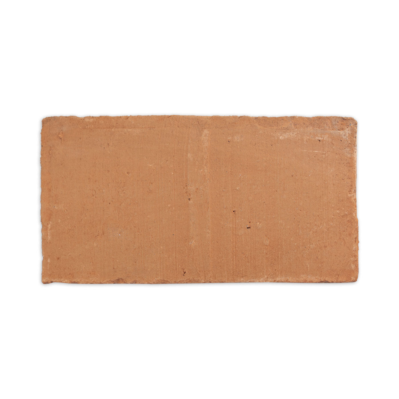 Terracotta baked paver sample by Clay Imports Pavers, with a rough, rustic texture.