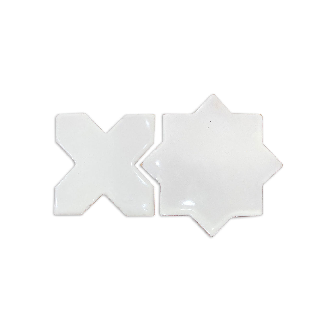 White gloss glazed mini star and cross tiles by Clay Imports, featuring an X-shape and an 8-point star tile.