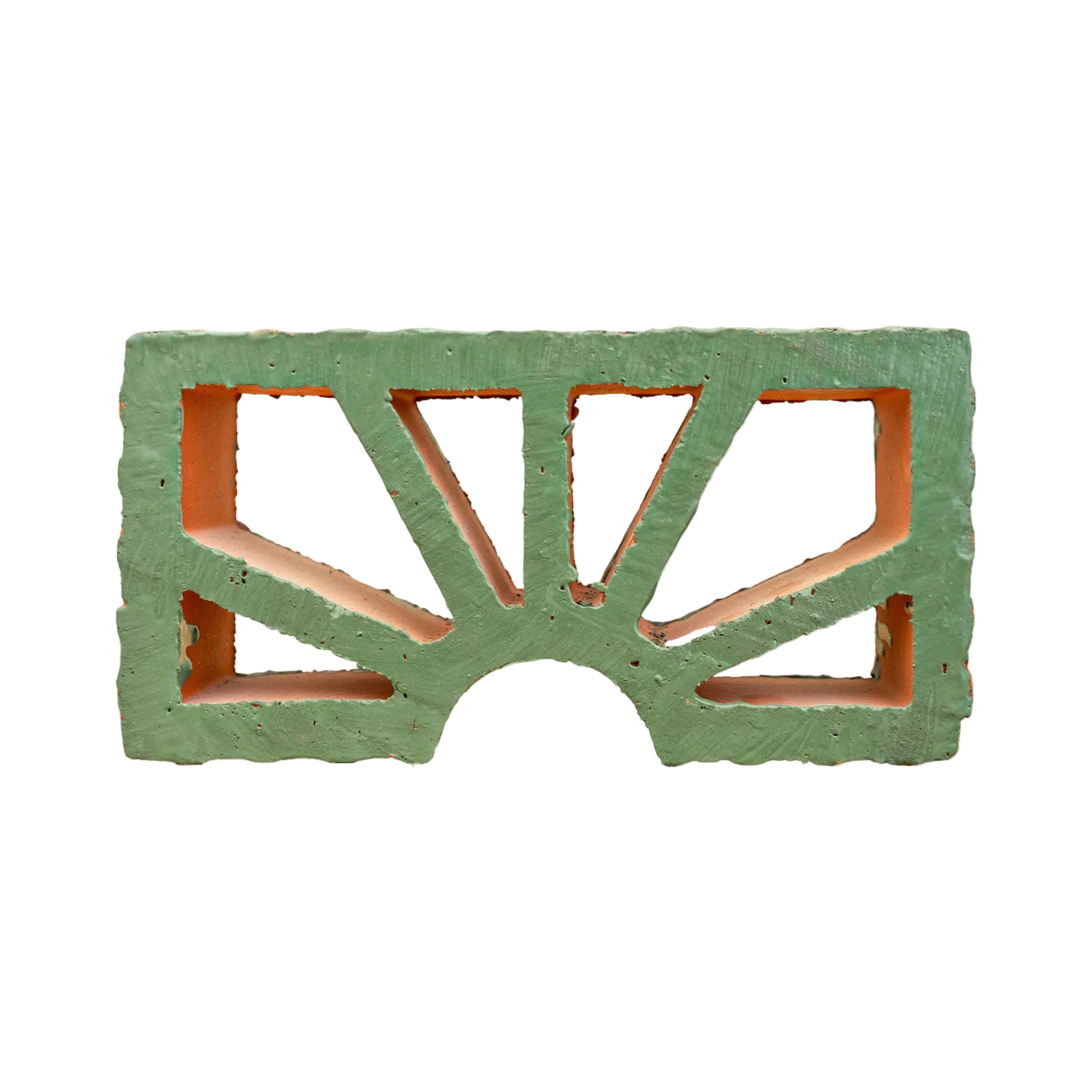 Evergreen glazed breeze block by Clay Imports Breeze Blocks, featuring a Petalo sunburst pattern revealing orange terracotta.